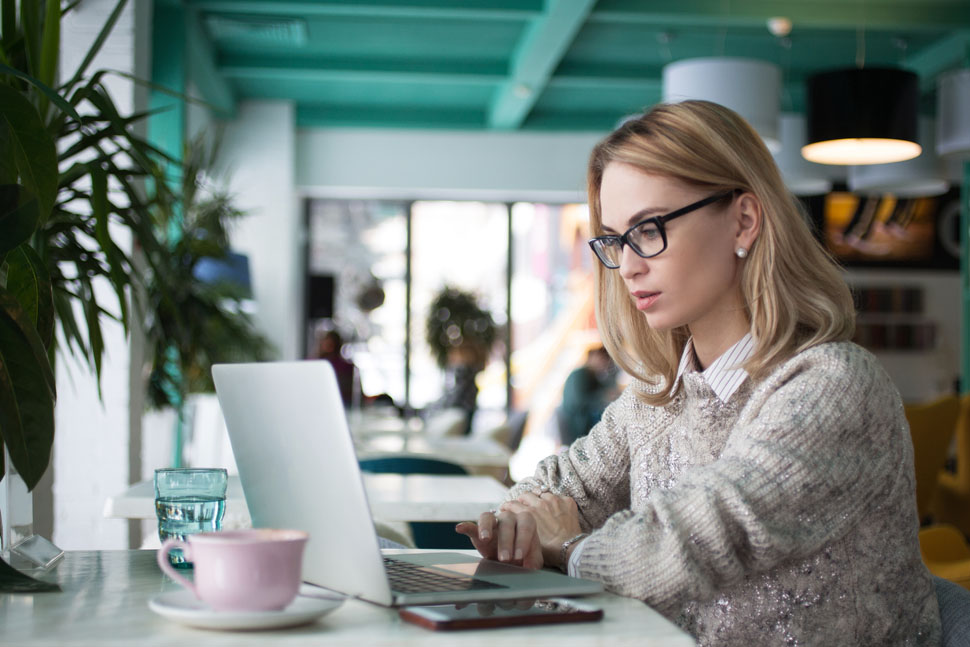 woman reading about Online Reputation Management using her laptop