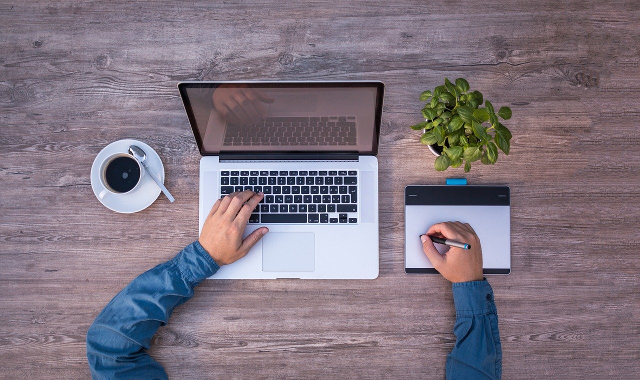 web designer working on a laptop and tablet