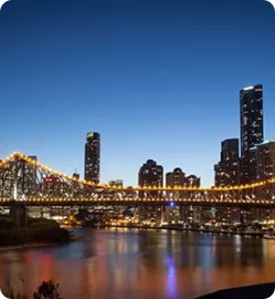 image of buildings and a bridge located in Perth at night time