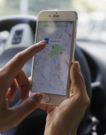 close-up of a woman's hands using Google maps on a mobile phone 