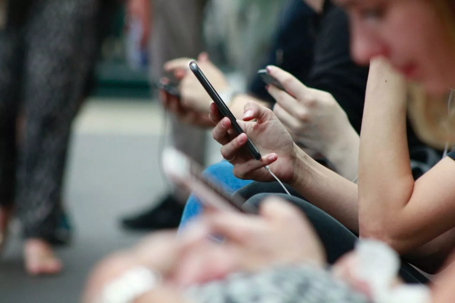 person using a mobile phone while in a public transport