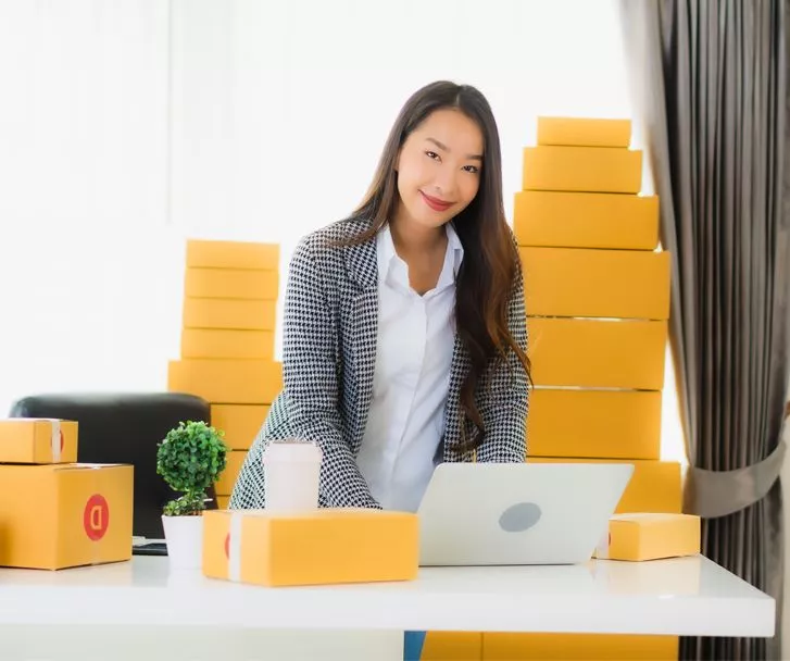 businesswoman handling all the orders of customers for delivery