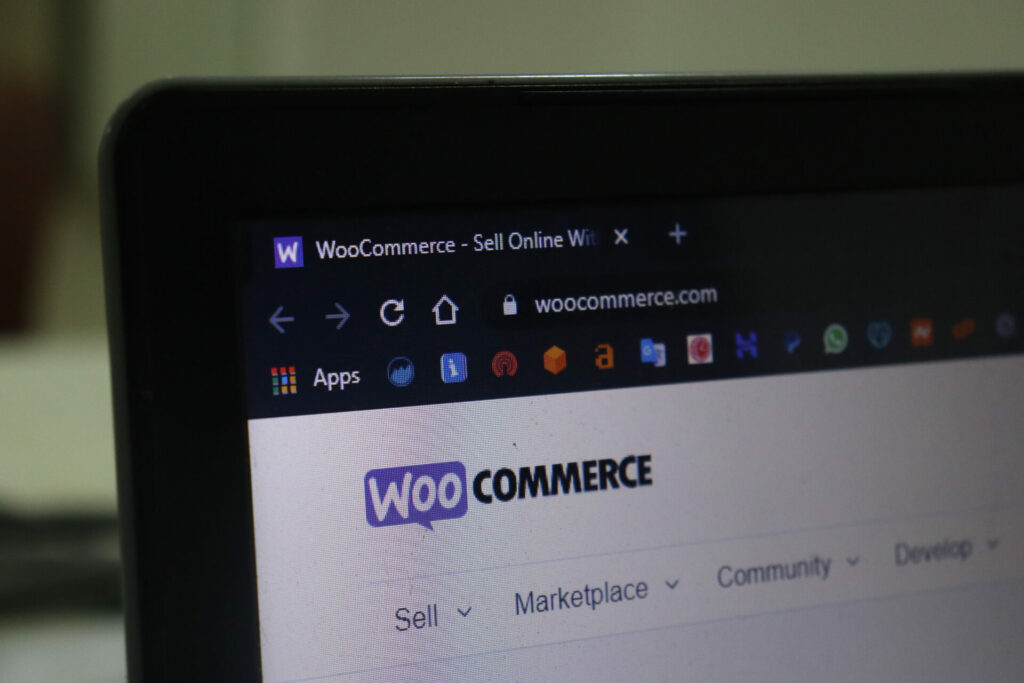 WooCommerce logo displaying on the laptop screen