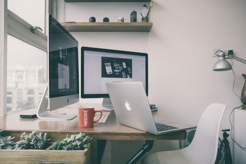 Workstation with two monitor and a macbook