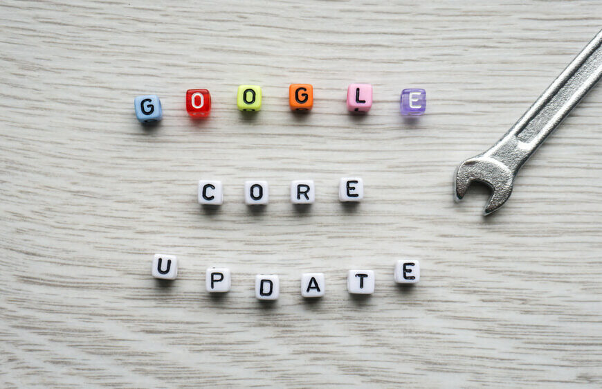 Google Core Update spelled using colourful beads on table with small stainless wrench