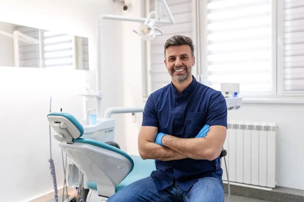 dentist sitting and smiling